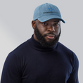 Load image into Gallery viewer, Check out our Denim Hat featuring the iconic Onward Motion logo!