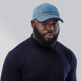 Load image into Gallery viewer, Check out our Denim Hat featuring the iconic Onward Motion logo!
